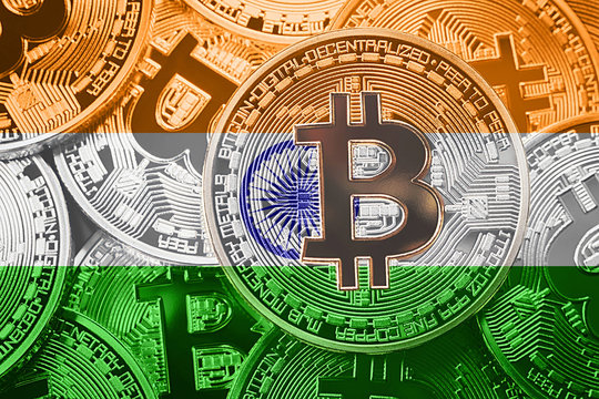 Stack of Bitcoin India flag. Bitcoin cryptocurrencies concept. BTC background.