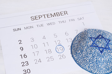 Calendar with kippah. Yom kippur concept.