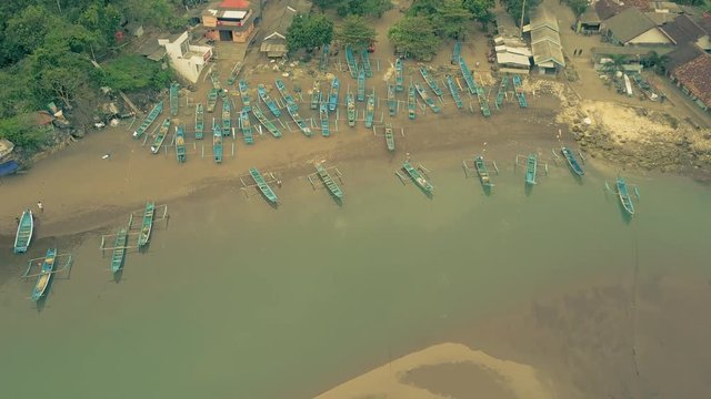 Baron beach traditional fishing boats docked to the shore aerial view, Yogyakarta, Indonesia