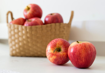 apples with a basket behind