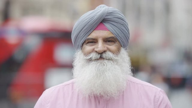 Portrait of Indian male smiling to camera in the city