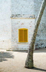 A yellow window in the Matara Lighthouse, Sri Lanka - 212402213