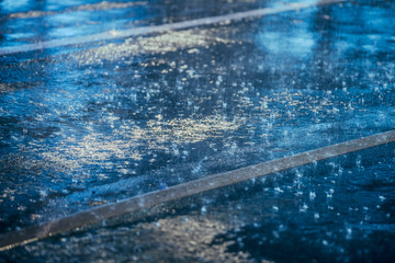 Cars driving on wet road in the rain with headlights