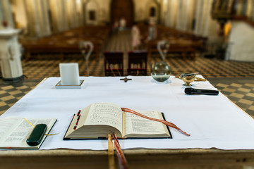 praying book on the altar in a church before wedding focused on the bible