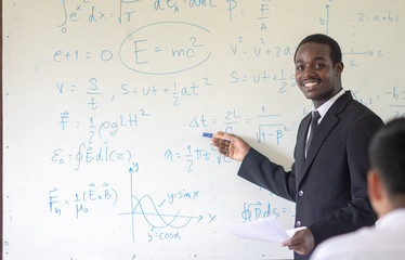 African science teacher teaching in the classroom.