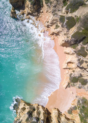 Aerial view of tropical sandy beach and turquoise ocean.