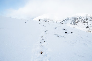People hiking on the beautiful snow mountains. kahurangi national park, New Zealand.
