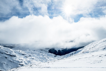 The stunning landscape of the snowy mountain on a foggy misty cloudy day. Kahurangi national park, New Zealand.