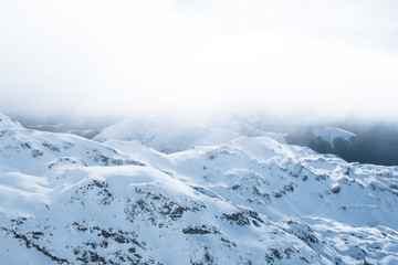 The stunning landscape of the snowy mountain on a foggy misty cloudy day. Kahurangi national park, New Zealand.