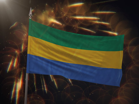 Flag of Gabon with fireworks display in the background
