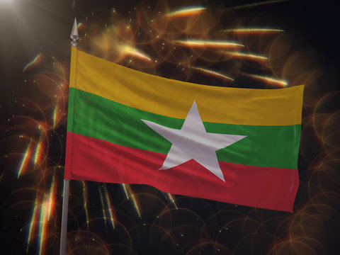 Flag of Myanmar with fireworks display in the background