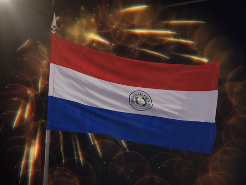 Flag of Paraguay with fireworks display in the background