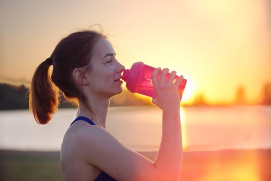 Girl Drinking Water After Running