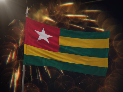 Flag of Togo with fireworks display in the background