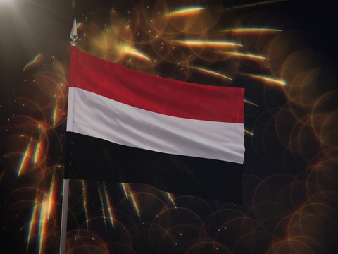 Flag of Yemen with fireworks display in the background