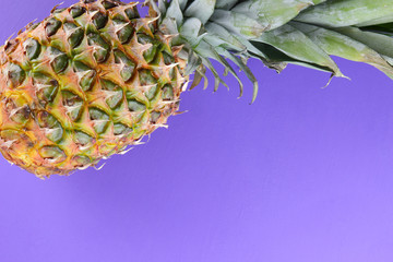 Pineapple on purple background, exotic fruit top view, pineapple for designer in pop art style,...