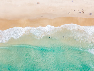 An aerial view of the water at the beach on a clear day on the Gold Coast in Australia