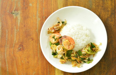 spicy fried prawn and squid with herb on rice