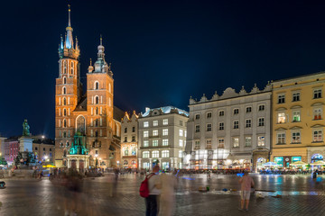 beautiful square of Krakow twilight, view of the Church of Mary
