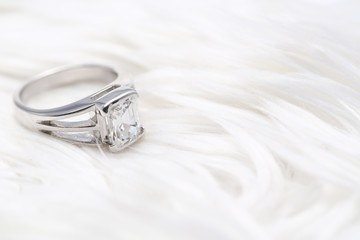 Beautiful diamond ring on white fabric