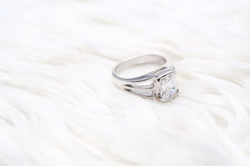 Beautiful diamond ring on white fabric