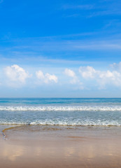 Deserted sandy beach of the Indian Ocean and blue sky,