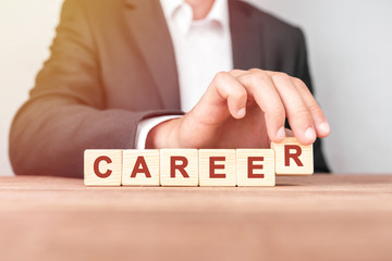 Man made word CAREER with wood blocks