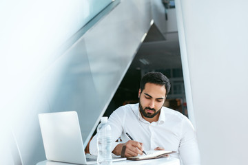 Business Man Working On Computer In Cafe