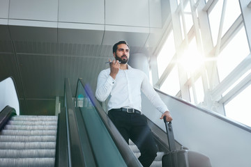Business Trip. Business Man Traveling In Airport