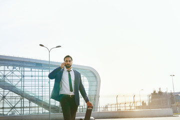 Business Man Talking On Mobile Phone Outdoors