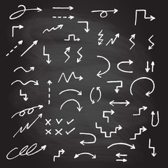 Hand drawn arrow set isolated on blackboard texture with chalk rubbed background. Doodle arrows sketch. Vector illustration.