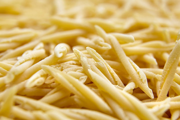 Dry Uncooked Trofie Italian Pasta . Food Background