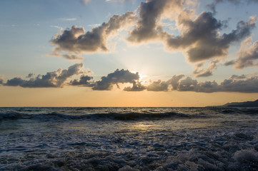 Amazing sea sunset, the sun, waves, clouds