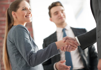 closeup of a business handshake partners.