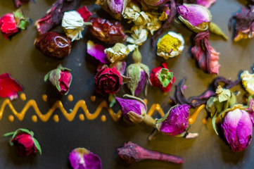 Fototapeta na wymiar flower tea-buds and fruits of wild rose, chamomile and other ingredients