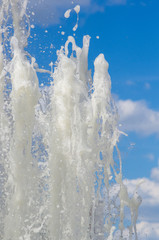 Naklejka na ściany i meble Fountain in city park on hot summer day