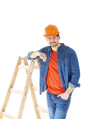 Young handyman with ladder. Portrait of handsome construction worker with his ladder standing at isolated white background with copy space. 