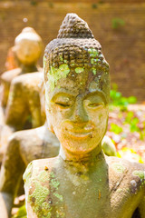 Ancient Thai Buddha statue of Wat Umong temple in Chiang Mai in Thailand