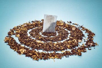 tea bags with scattered dry tea