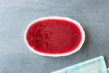 Red Plum Marmalade Jam in Ceramic Bowl.