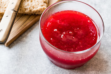 Red Plum Marmalade Jam with Bread and in glass Bowl.