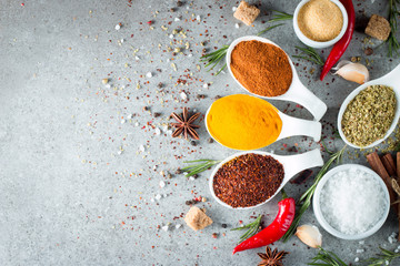 Spices. Spice in Wooden spoon. Herbs. Curry, Saffron, turmeric, cinnamon and other on a wooden...