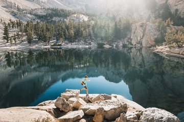 young man in  Yosemite, USA: Mountain landscape with mirror lake surrounded by high peaks