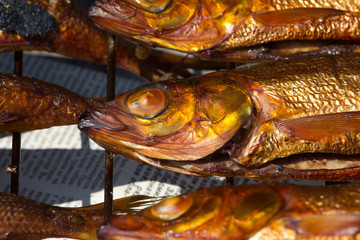 Hot smoked fish omul from Baikal, delicacy in Russia