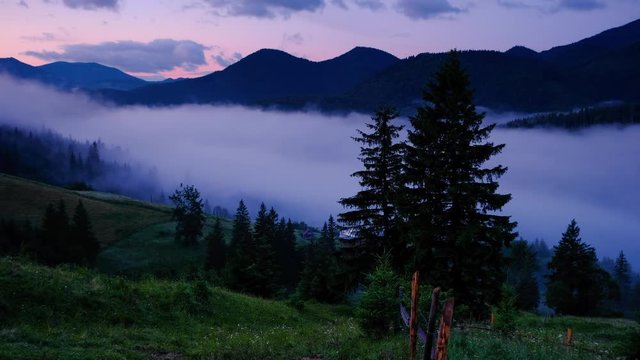 Time lapse 4K video of clouds and fog moving at mountain valley