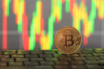 Golden bitcoin close-up on a blurred background