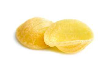Two Dry Uncooked Orecchiette Italian Pasta . Isolated on White Background