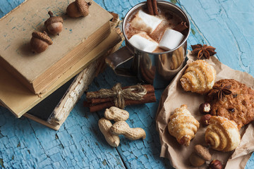 Metal mugs with cacao and marshmallows