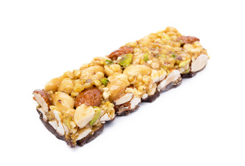 Nut bar with chocolate isolated on white background