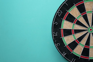 Target dart board on the green background, center point, head to target marketing and business...
